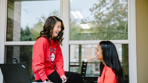 two students studying outside on central campus