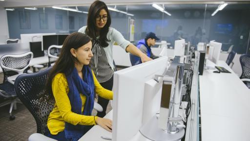 student and professor in computer lab