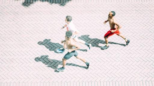 students running around campus