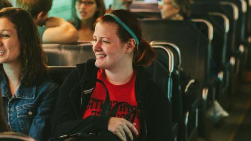 students riding the metra train